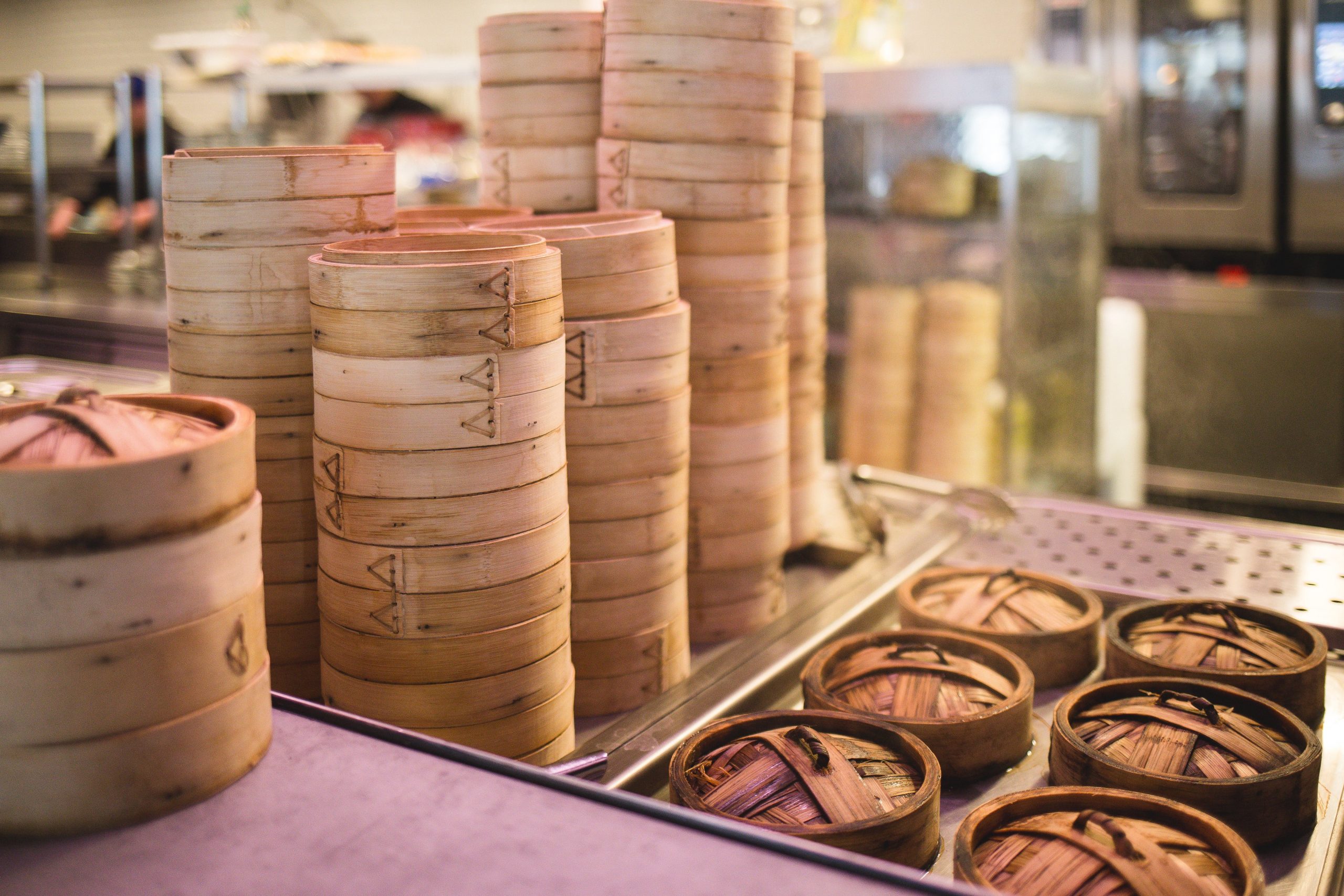 An image of bamboo steamers probably filled with yummy dim sum.