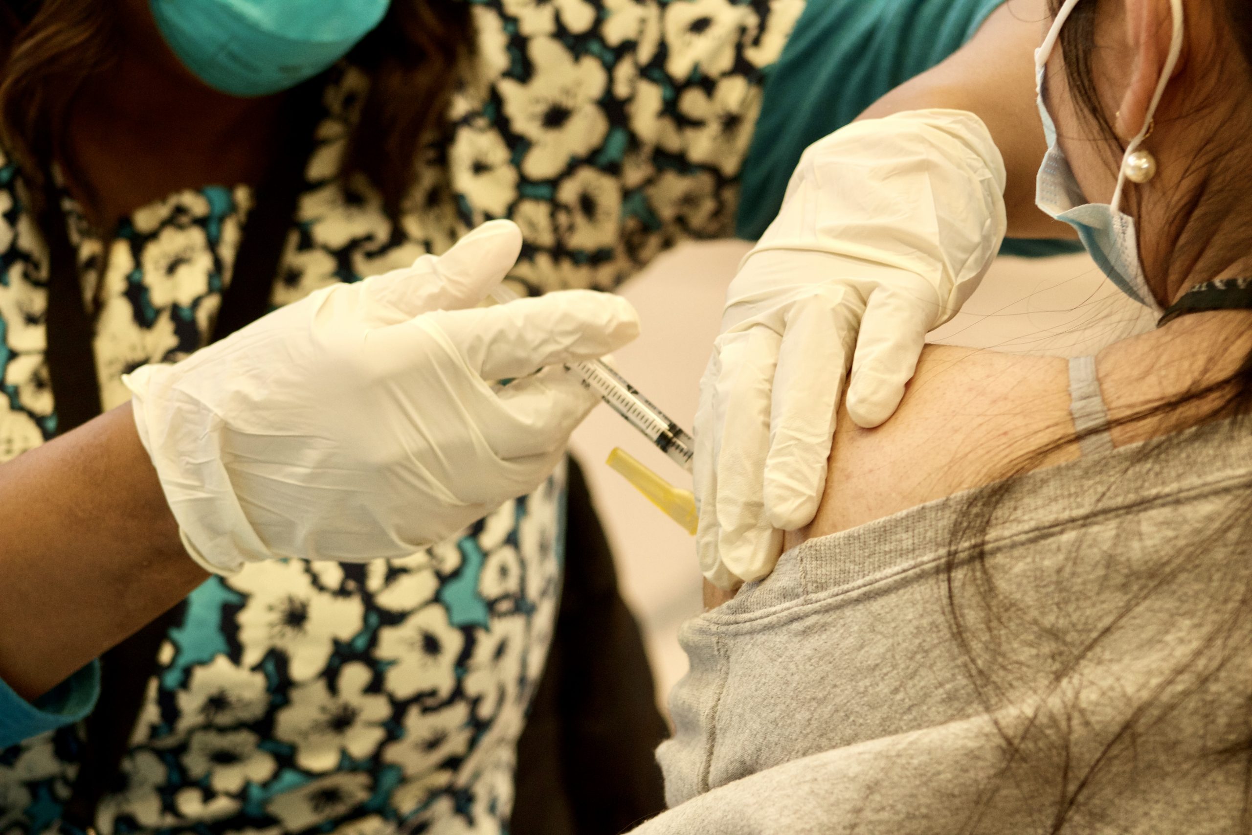 a close up of a syringe going into an arm