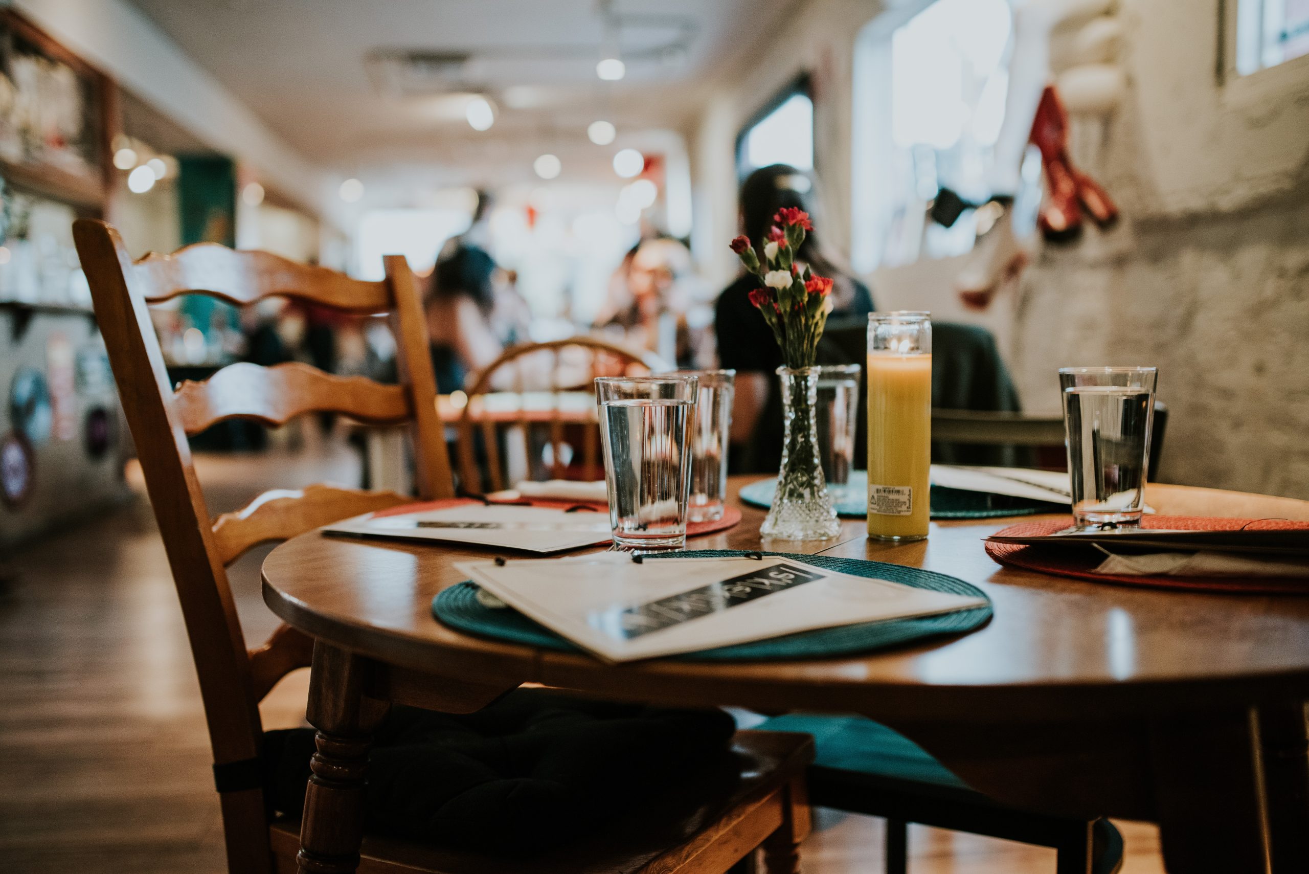 closeup of an indoor wooden table at a restaurant
