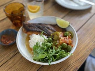 a photo of a table with food on it in a bowl and glass