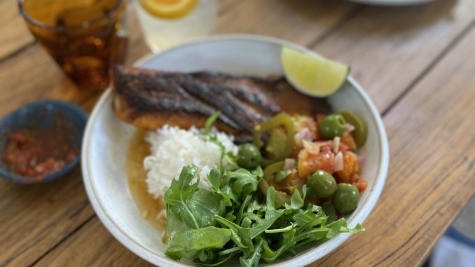 a photo of a table with food on it in a bowl and glass