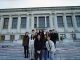 a group of diverse UC Berkeley students stand in front of a big library