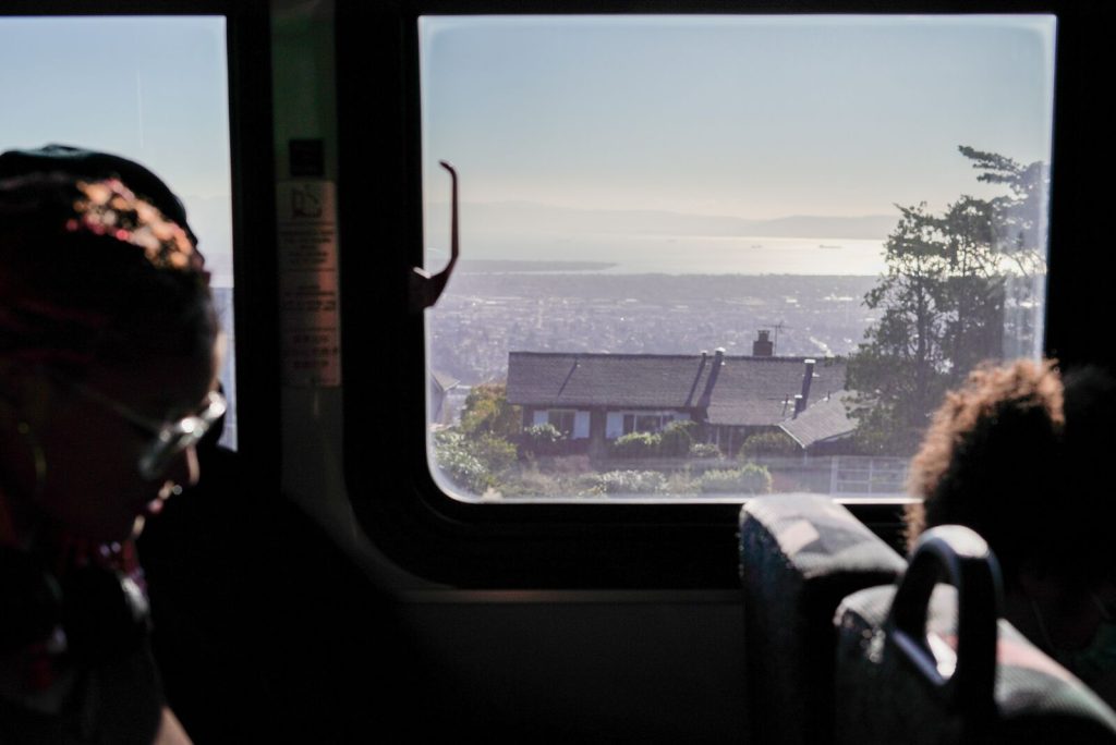 inside a bus, you can see the views of the bridge and bay area