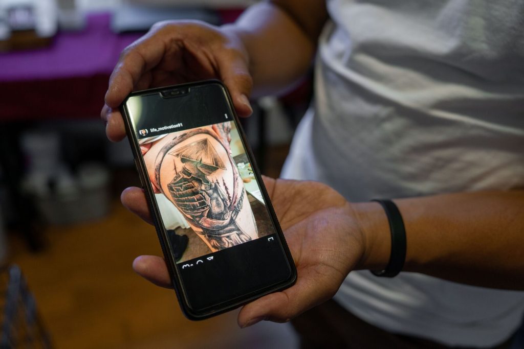 a photo of an iphone with an image of a tattoo 