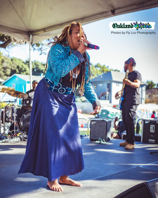 woman on microphone wearing dreadlocs