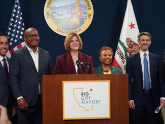 a group stands behind podium