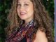 picture of woman smiling with curly hair