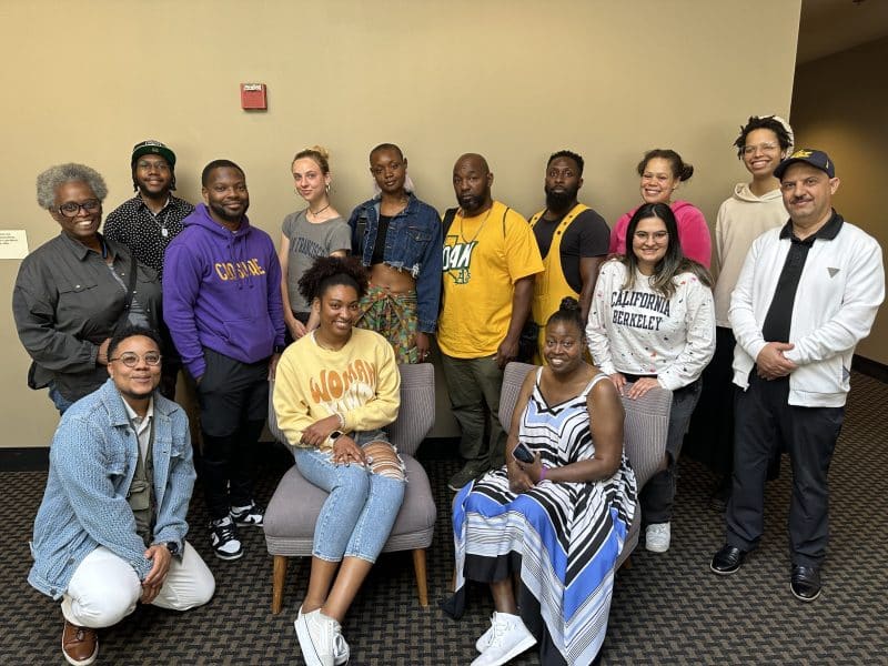 Diverse group of Oakland residents seated and standing together for photograph. All selected for 2024 Academy.